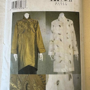 May include: A sewing pattern by Marcy Tilton, showing two long-sleeved jackets. One is olive green with embroidered details, and the other is off-white with a feather pattern. The pattern size is L/XL.