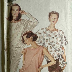 May include: Vintage New Look sewing pattern featuring illustrations of three different women's tops. The tops include a long-sleeved blouse, a short-sleeved top with a leaf pattern, and a sleeveless top. The pattern is for sizes 8-18.