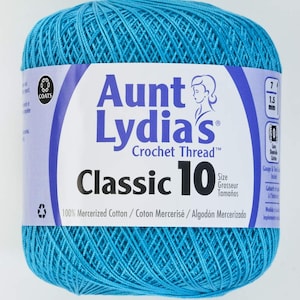 May include: A skein of turquoise blue Aunt Lydia's Classic 10 crochet thread. The label reads "Aunt Lydia's Crochet Thread" and "Classic 10". It also states that the thread is 100% mercerized cotton.