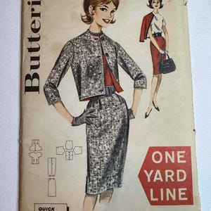 May include: Vintage Butterick sewing pattern featuring a woman in a tweed jacket and skirt suit. The pattern includes illustrations of the outfit and the words "Quick 'N Easy" and "One Yard Line". The bust size is 34 and the size is 14.