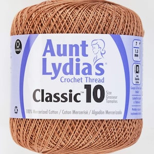 May include: A ball of brown Aunt Lydia's Classic 10 crochet thread. The label says "100% Mercerized Cotton/Coton Mercerisé/Algodón Mercerizado".