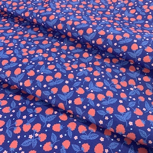 May include: Blue fabric with a repeating pattern of red raspberries, blue leaves, and small white and blue flowers.