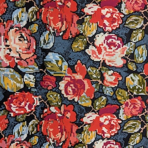 May include: A dark blue fabric with a repeating pattern of red, pink, and white roses. The roses are stylized and have a pixelated appearance.