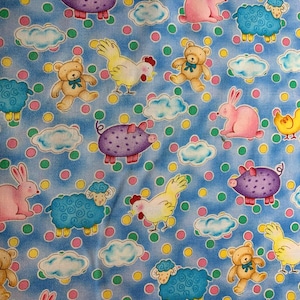 May include: A blue fabric featuring a repeating pattern of cartoon animals including purple pigs, pink rabbits, yellow chickens, blue sheep, and tan teddy bears, interspersed with white clouds and small green and yellow polka dots throughout.