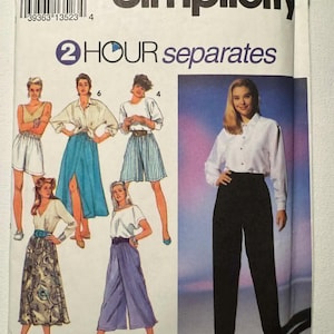 May include: A vintage Simplicity sewing pattern envelope with illustrations of women's separates. The envelope features the text "2 HOUR separates" and the Simplicity logo. The pattern includes various styles of tops, skirts, and trousers.