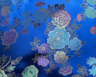 Tela jacquard con brocado de seda sintética en azul real con flores multicolores