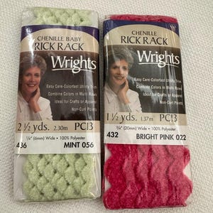 May include: Two packages of Wrights Chenille Rick Rack trim. One is mint green, 2 1/2 yards long, 1/4 inch wide. The other is bright pink, 1 1/2 yards long, 3/4 inch wide. Both are 100% polyester.