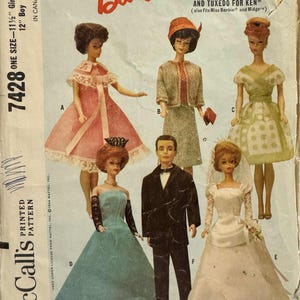 May include: Vintage Barbie doll wardrobe pattern from 1964. The pattern features various outfits, including dresses, a suit, and a tuxedo. The cover displays Barbie and Ken dolls in the outfits. The pattern is marked "Official Barbie" and "McCall's".