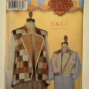 May include: Simplicity Quilters Only Fabrics sewing pattern. The pattern features two jacket designs on dress forms. One jacket has a patchwork design in shades of brown, tan, and cream. The other jacket has a floral print.