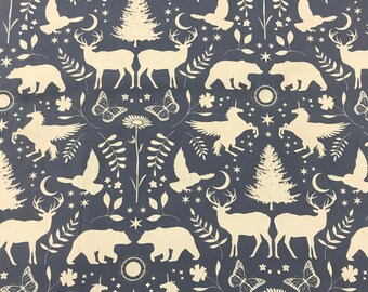 May include: A seamless pattern featuring a white unicorn, deer, bear, and tree on a dark blue background. The pattern also includes stars, moons, butterflies, and flowers.