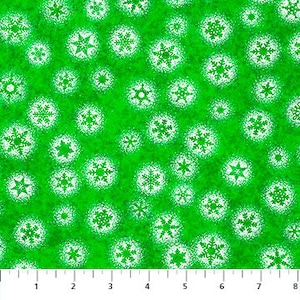 May include: Green fabric with a white snowflake pattern. The snowflakes are of various sizes and shapes.