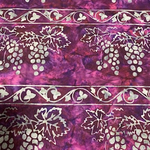 May include: Purple fabric with a white grapevine pattern. The grapes are white and the leaves are white with a dark purple outline. The fabric has a mottled purple background.