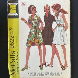 May include: A McCall's 9622 sewing pattern envelope featuring illustrations of three wrap dresses in different styles. The text includes 'McCall's 9622', 'time saving Quickie', 'New Sizing', and 'Wrap dress in three versions in women's sizes and half sizes'.