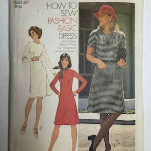 May include: Vintage Simplicity sewing pattern 7079 for a fashion basic dress. The pattern includes illustrations of the dress in different styles. The text on the pattern reads "How to Sew Fashion Basic Dress". Size 14, Bust 36 inches.