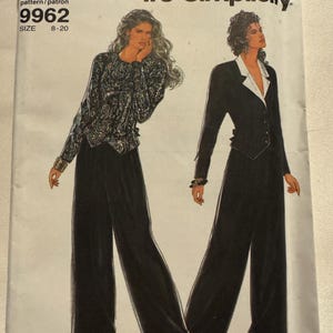 May include: A vintage Simplicity sewing pattern featuring two women's fashion designs. The pattern includes a black blazer with white lapels and wide-leg pants. The text "It's SO EASY" and "it's Simplicity" are visible.