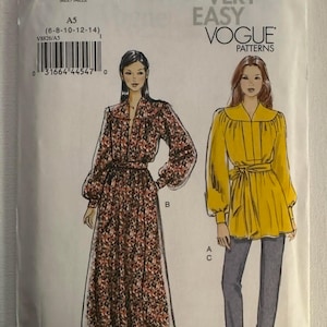 May include: Vogue Patterns sewing pattern envelope. The envelope features illustrations of two women wearing different outfits. One woman is wearing a floral print dress, and the other is wearing a yellow top and gray pants. The envelope has the text "VERY EASY VOGUE PATTERNS".