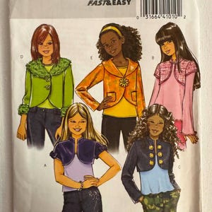 May include: A Butterick B4847 sewing pattern envelope for girls' jackets in sizes 7-14. The cover features illustrations of five different jacket styles labeled A, B, C, D, and E, showcasing various colors, textures, and button or floral embellishments.