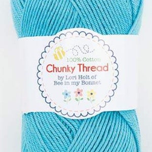 May include: A ball of turquoise blue 100% cotton yarn labeled "Chunky Thread by Lori Holt of Bee in my Bonnet."