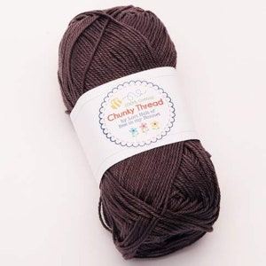 May include: A skein of brown 100% cotton yarn labeled "Chunky Thread by Lori Holt of Bee in my Bonnet".