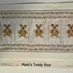 May include: A vintage printed pattern featuring five teddy bears with bow ties, set against a textured background. The text "Mark's Teddy Bear" is displayed at the bottom, along with copyright information.