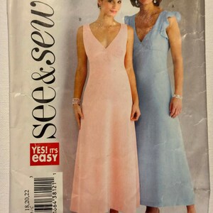 May include: A vintage sewing pattern featuring two women modeling long, elegant dresses. One dress is a soft pink, the other a light blue. The pattern cover has the text "see & sew" and "YES! It's EASY".