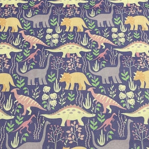 May include: A fabric with a repeating pattern of various dinosaurs in shades of yellow, pink, gray, and orange, set against a dark blue background. The design includes stylized plants and foliage, creating a prehistoric theme.