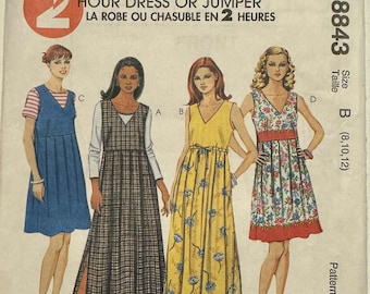 1997 McCall's jumper with pleated skirt. Pattern # 8843 Size: 8,10,12