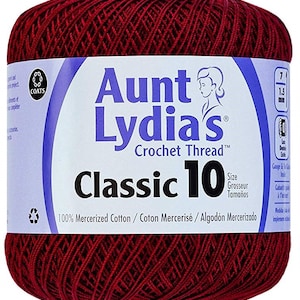 May include: A ball of Aunt Lydia's Classic 10 crochet thread in a deep red color. The label reads "Aunt Lydia's Crochet Thread" and "Classic 10". It is 100% mercerized cotton.