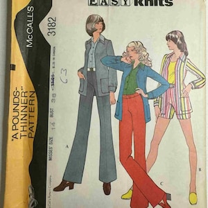 May include: Vintage McCall's sewing pattern envelope featuring illustrations of women's knit outfits. The envelope displays the text "EASY knits" and "A POUNDS-THINNER PATTERN". The pattern includes a jacket and pants suit, a jacket and pants ensemble, and a striped shorts set.
