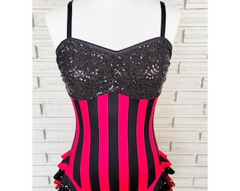 May include: A black and red striped leotard with a black sequined bodice and a ruffled hem.