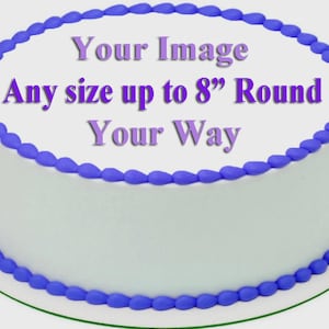 May include: A round white cake with purple frosting trim and the text "Your Image Any size up to 8" Round Your Way" in purple. The cake is on a green cake board.