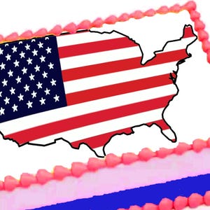 May include: A rectangular cake decorated with a map of the United States and the American flag. The cake has pink frosting around the edges and a blue and pink layer at the bottom. The flag design features red and white stripes and a blue field with white stars.