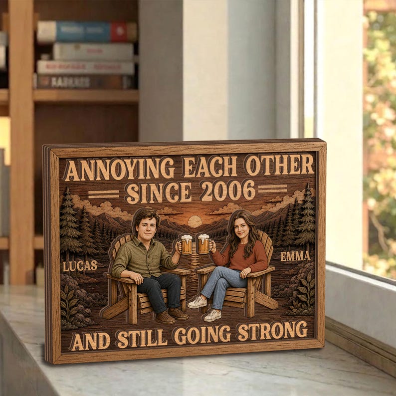 May include: A rectangular wooden sign featuring an illustration of two people sitting in chairs, holding beer mugs, with a forest background. The text reads: ANNOYING EACH OTHER SINCE 2006, LUCAS, EMMA, AND STILL GOING STRONG. The design has a rustic wood grain finish.
