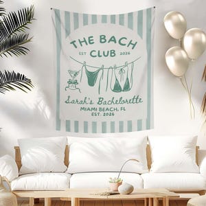 May include: A white and light blue wall tapestry with the text "THE BACH CLUB EST 2026" and "Sarah's Bachelorette MIAMI BEACH, FL EST. 2026". The tapestry features a cocktail and swimwear illustrations.