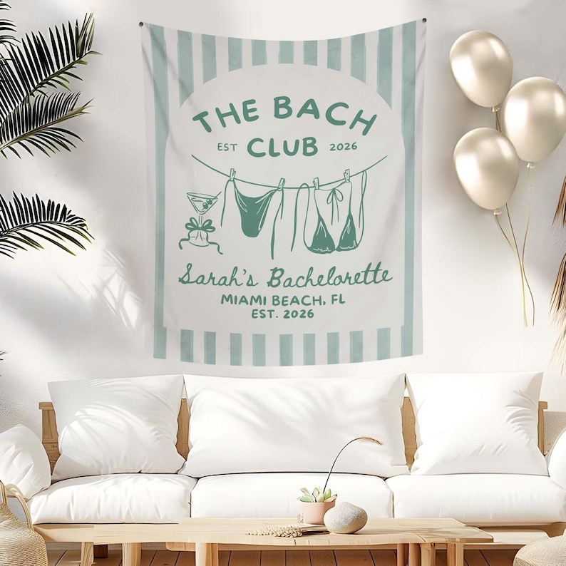 May include: A white and light blue wall tapestry with the text "THE BACH CLUB EST 2026" and "Sarah's Bachelorette MIAMI BEACH, FL EST. 2026". The tapestry features a cocktail and swimwear illustrations.