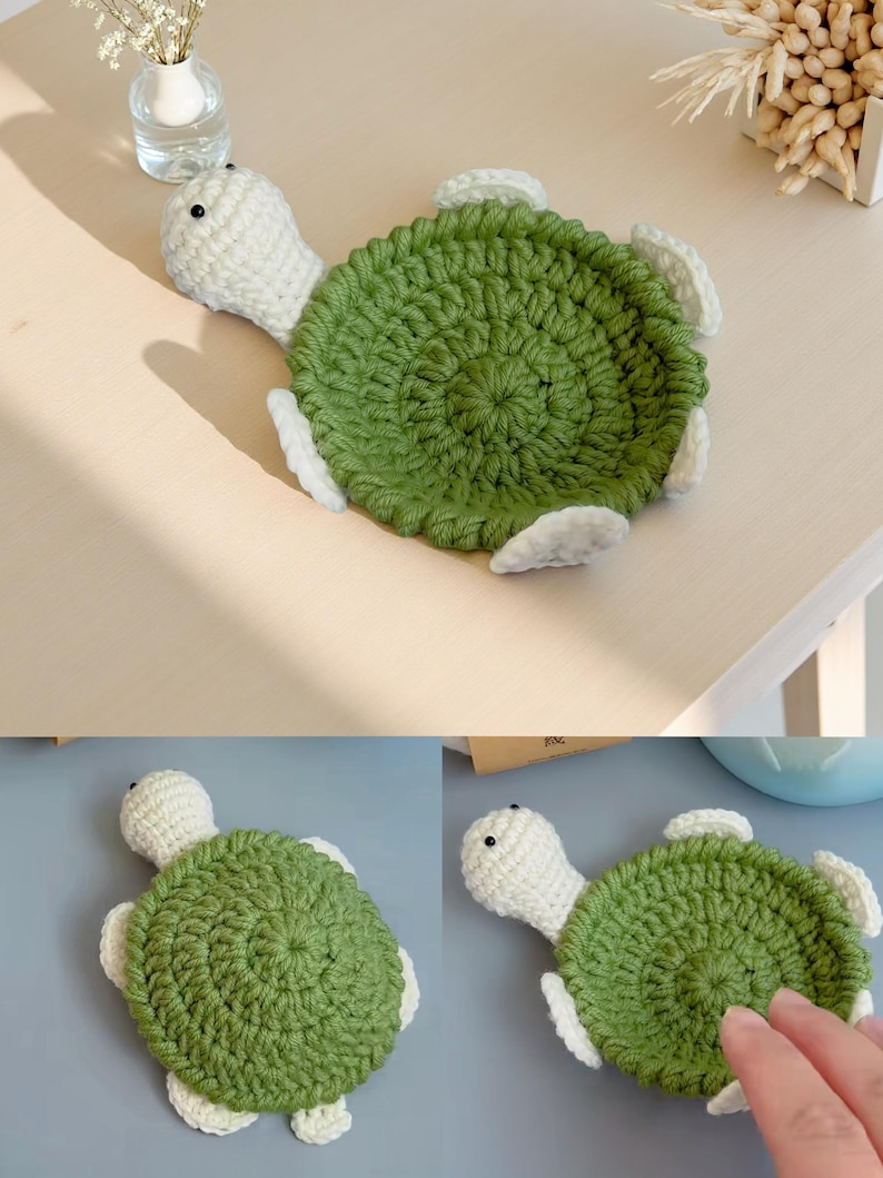 May include: A handmade crochet turtle coaster. The turtle has a green shell, white head, and white flippers. The coaster is designed to protect surfaces from drink condensation. The turtle is approximately 5 inches in diameter.