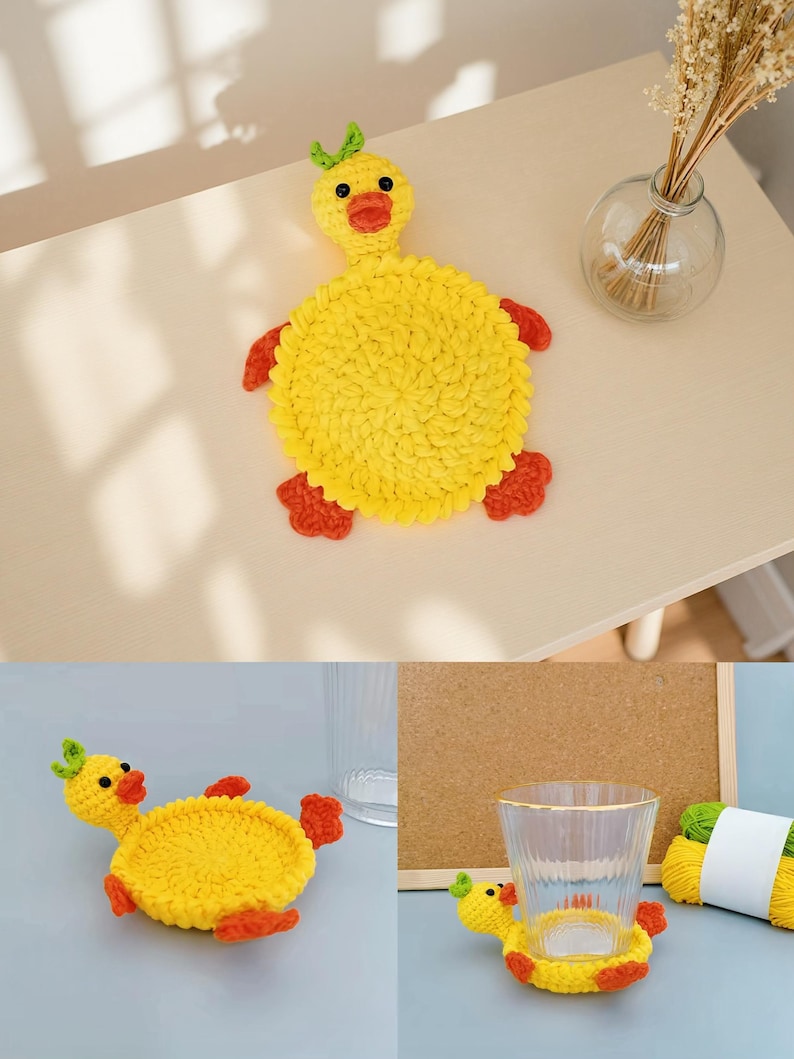 May include: A handmade yellow crochet duck coaster with orange feet and beak, and green accents. The duck-shaped coaster is designed to hold a glass or cup. The coaster is on a light-colored surface.
