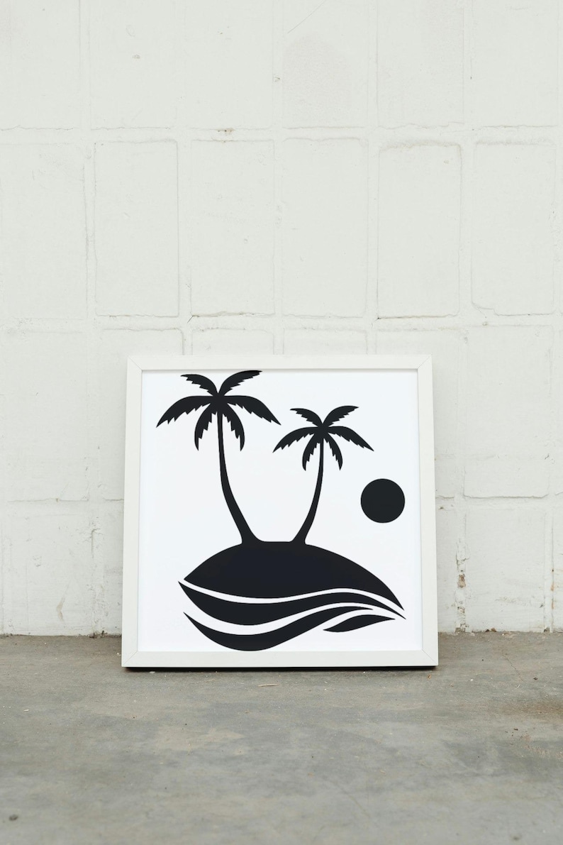 May include: Black and white print of two palm trees on an island with a sun in the background. The print is framed in a white frame.