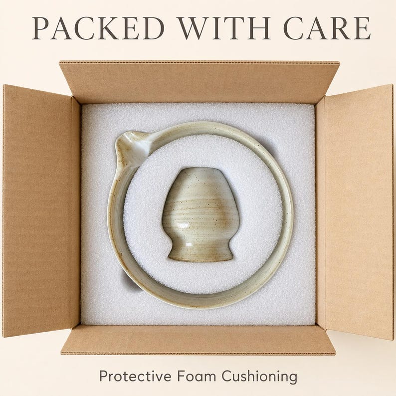 May include: A beige ceramic bowl with a side spout and a matching beige ceramic cup nestled inside a cardboard shipping box with white protective foam cushioning. The text PACKED WITH CARE and Protective Foam Cushioning is visible.