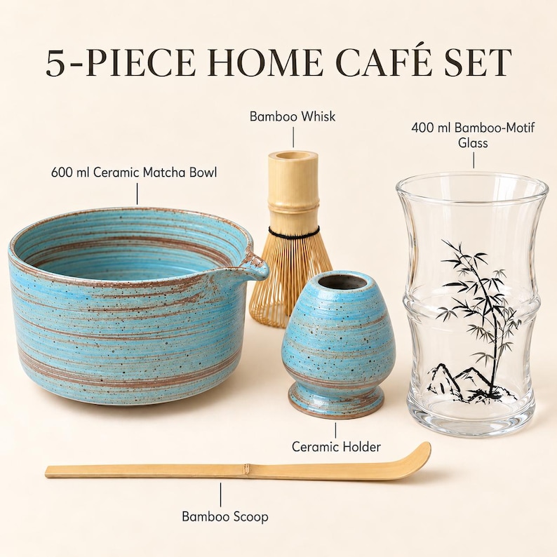 May include: A 5-piece home caf&eacute; set including a 600 ml blue ceramic matcha bowl, a bamboo whisk, a ceramic holder, a 400 ml bamboo-motif glass, and a bamboo scoop. The items are arranged together, featuring blue speckled ceramic and natural bamboo.