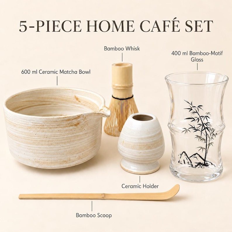 May include: A 5-piece home caf&eacute; set including a 600 ml ceramic matcha bowl, a bamboo whisk, a ceramic holder, a 400 ml bamboo-motif glass, and a bamboo scoop. The items are arranged together, featuring natural beige tones and a black bamboo illustration.