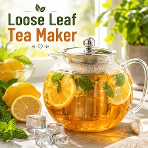 May include: A clear glass loose leaf tea maker with a metal lid and internal mesh infuser, filled with amber tea, lemon slices, and fresh mint leaves. The text "Loose Leaf Tea Maker" is printed in green and orange above the glass teapot.