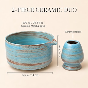 May include: A 2-piece ceramic duo featuring a 600 ml, 20.3 fl oz matcha bowl with a spout and a 3.2 inch tall ceramic holder. Both items have a blue glaze with brown horizontal streaks and speckles. The bowl is 5.5 inches in diameter.