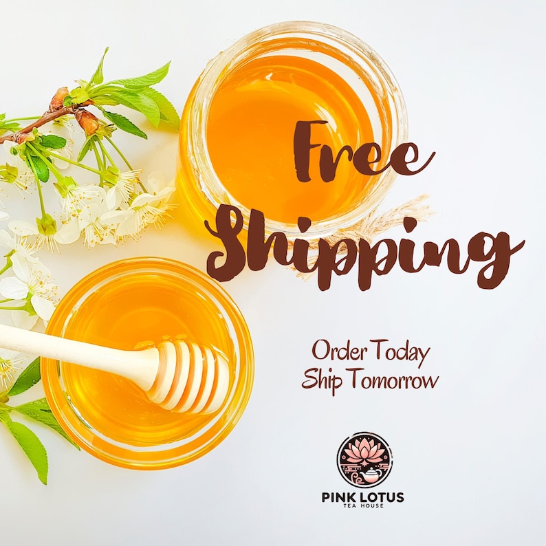 May include: Two glass jars filled with golden honey, one with a wooden honey dipper. The words "Free Shipping" are displayed in a brown script font. White flowers and green leaves are arranged around the jars. The Pink Lotus Tea House logo is at the bottom.