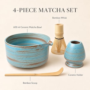 May include: A 4-piece matcha set featuring a 600 ml ceramic matcha bowl with blue and brown horizontal stripes, a bamboo whisk, a bamboo scoop, and a blue and brown ceramic holder. The text 4-PIECE MATCHA SET is displayed at the top.