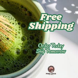 May include: A light green ceramic bowl filled with vibrant green matcha tea, featuring a bamboo whisk partially submerged in the frothy liquid. The image includes the text Pink Lotus Tea House and a lotus flower logo at the bottom right corner.