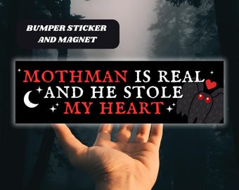 May include: Black and white bumper sticker with the text "Mothman is real and he stole my heart" with a red heart and a cartoon moth with red eyes.