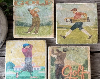 May include: Set of four square coasters featuring vintage illustrations of golfers on a green golf course. The coasters are made of stone and have a distressed, aged look. The text "Golf" appears on one of the coasters.