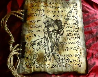 May include: Aged parchment with a detailed illustration of a monstrous figure holding a staff adorned with skulls. The artwork is in black ink, surrounded by cryptic symbols and text. The edges are frayed, and the binding is made of twine.