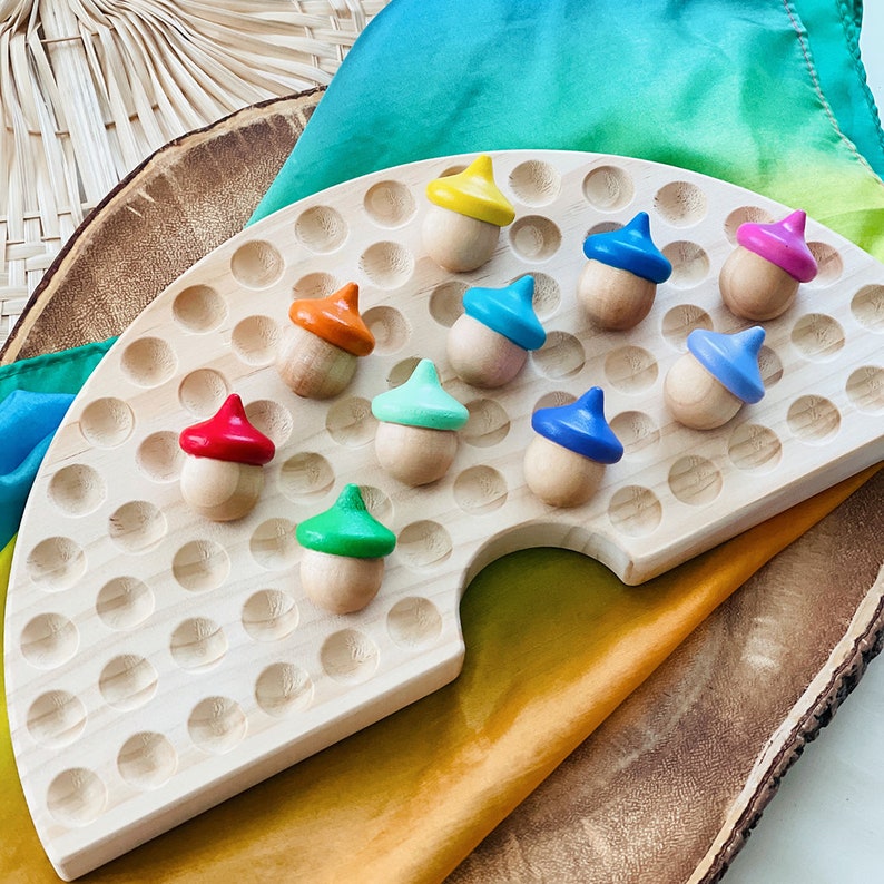 wooden rainbow Montessori sorting acorns for dramatic play